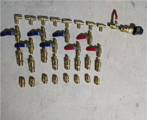 Pipe fittings and valves on a concrete floor